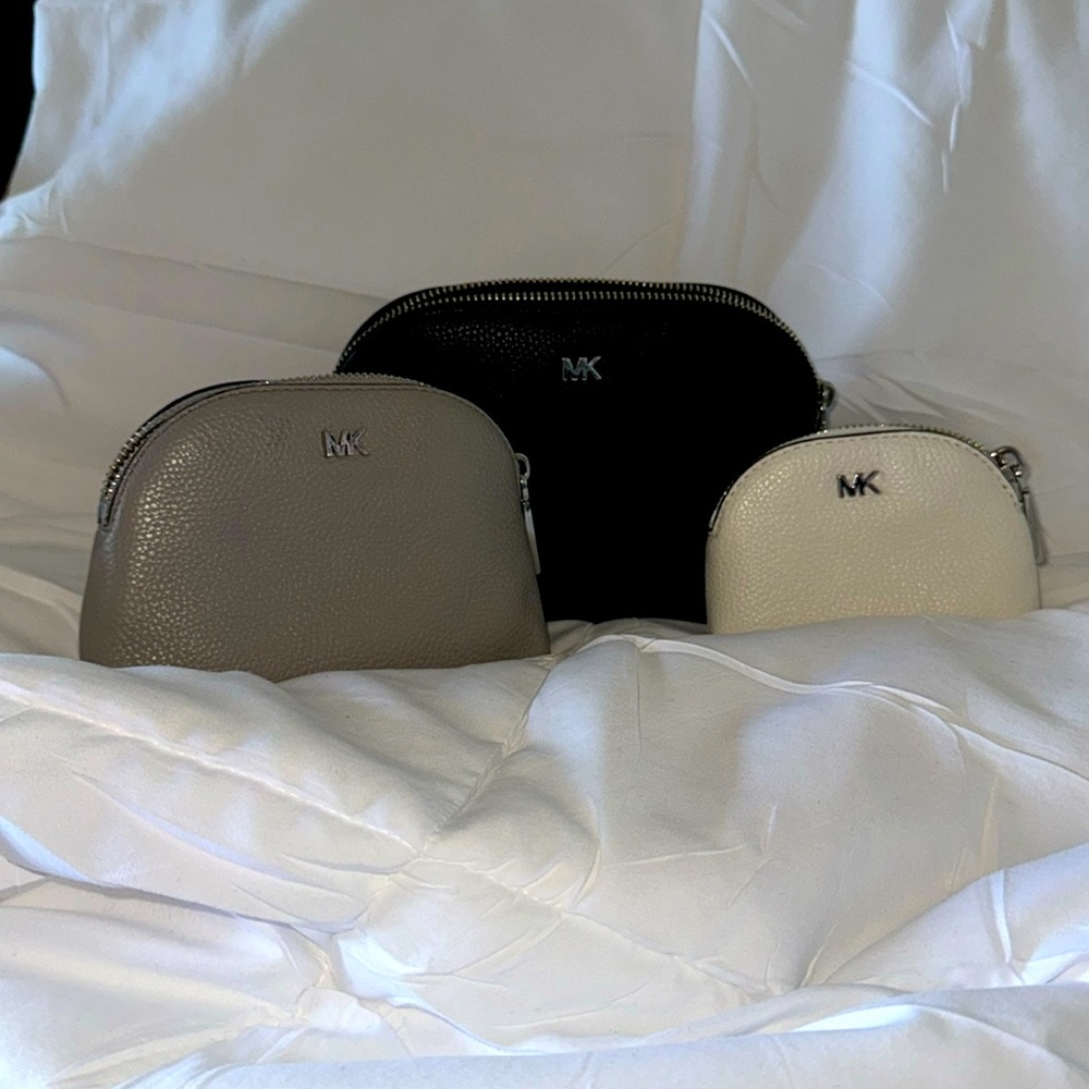 New never used Michael Kors purses.